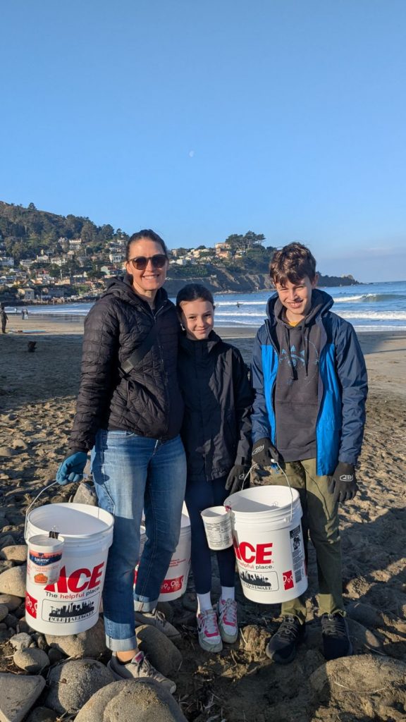 A family at PBC's 28th Annual Beach Planting and Cleanup